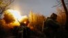UKRAINE -- Ukrainian soldiers in their positions open fire with howitzers on Russian forces. Kherson region, March 12, 2024