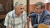 Евгений Мищенко (на фото слева) и его адвокат Николай Фомин в зале суда