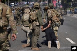 Рейды в Лос-Анжелесе. 7 июня 2025, фото AP