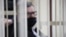 BELARUS -- Viktar Babaryka, former head of Belgazprombank and challenger in the 2020 presidential election, who was jailed on corruption charges, sits inside a defendants' cage before a court hearing in Minsk, February 17, 2021
