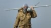 Ukraine - A Ukrainian soldier carries a surveillance drone near Mariupol. screen grab