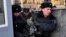 RUSSIA -- Police officers detain a protester as human rights activists gather outside the headquarters of the FSB security service, in Moscow, December 16, 2018