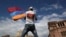 ARMENIA -- A man waves an Armenian flag at the Republic Square in Yerevan, Tuesday, May 8, 2018.