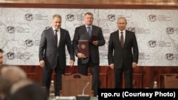 Сергей Шойгу, Андрей Бокарев и Владимир Путин на заседании совета Русского географического общества, 2017 год