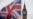 A Union flag flies in the wind in front of the Big Ben clock face and the Elizabeth Tower at the Houses of Parliament in central London