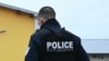 Police officers work to collect evidence at the site of a bladed weapon attack where a man is suspected of killing one person and wounding two municipal police officers in Mulhouse, eastern France on February 22, 2025.