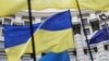 Ukraine -- Ukrainian national flags, flags of Ukrainian trade unions and EU flag are seen during a mass rally in front of the Ukrainian cabinet of ministers building in Kyiv, October 15, 2014