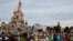 (FILES) Disney cast members take part in a parade during a ceremony marking the 100th anniversary of the Walt Disney Company, held at Disneyland Paris, in Marne-la-Vallee, east of Paris, on October 16, 2023.
