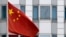 The Chinese flag is pictured in front of the building of the Chinese embassy in Berlin on April 22, 2024.
