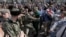 RUSSIA – Cosacks scuffle with opposition supporters during an unauthorized anti-Putin rally called by opposition leader Alexei Navalny in Moscow on May 5, 2018 