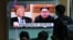 SOUTH KOREA -- People watch a TV screen showing file footage of U.S. President Donald Trump, left, and North Korean leader Kim Jong Un during a news program at the Seoul Railway Station in Seoul, South Korea, Wednesday, April 18, 2018. 