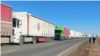 Kazakhstan – Trucks waiting in line at the border of Kazakhstan and Russia. Kurmangazy station.